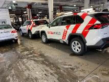 White car with red car wrap