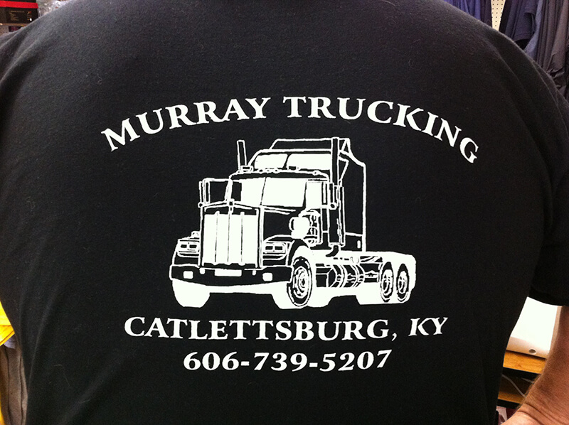 Murray Trucking embroidery on black shirt