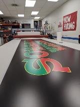 Custom banner with green and red lettering