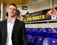 Student player with custom banner at the back