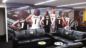 Towson university custom wall with images of the athletes