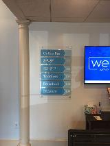 Blue Wayfinding sign with television on the wall