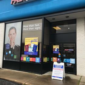 Signage is placed outside of the FASTSIGNS of Alexandria location