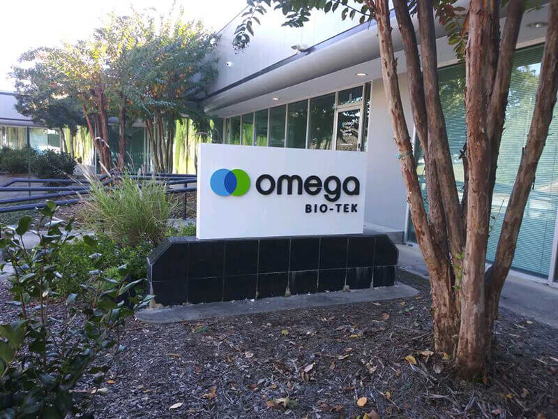 Omega Bio tek monument sign outside the office