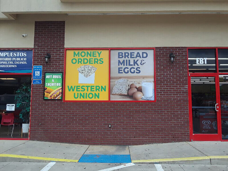 Images on the brick wall outside the store