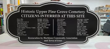 Custom signage for Historic Upper pine grove cemetery on the table inside the office