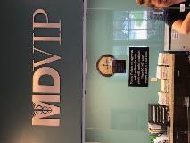 MD VIP custom decal on the reception area with the receptionist