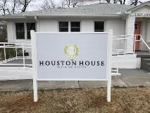 Houston House interior design signage in front of the white house