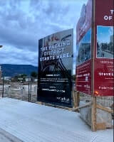 Property management construction sign on the snow