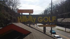 Hilibilly golf signage on the top of the building