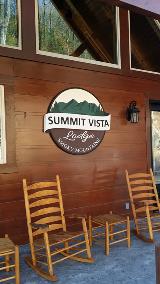 Summit cabin sign on the wooden wall