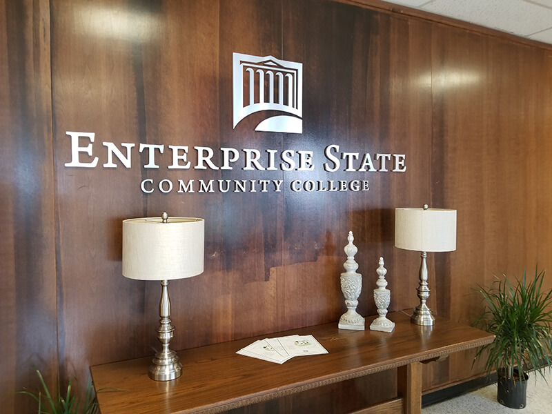 Enterprise state Logo on the wall office with lamps and table