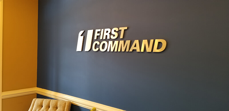 First Command Custom Decal on the wall with chair in the office