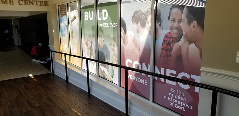 Group photo on the window of the establishment