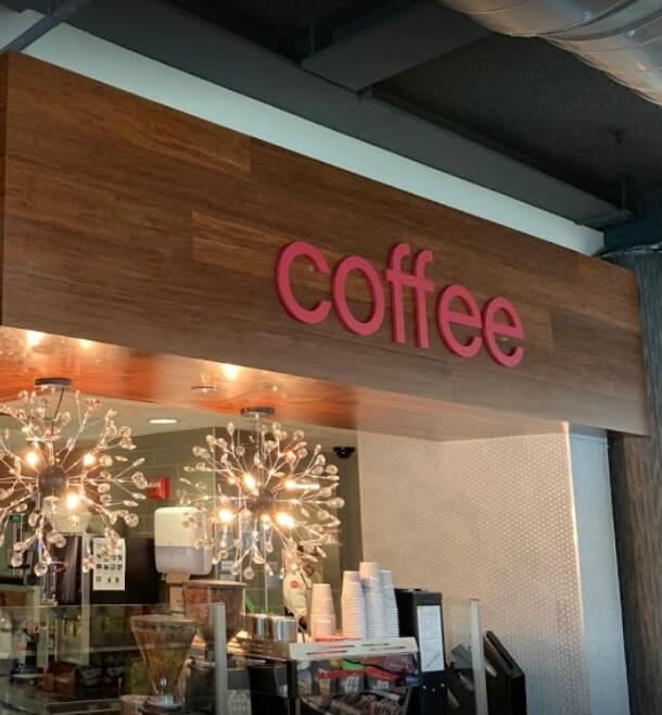 Coffee exterior signage on the wood wall