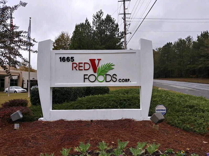 The Red V Foods corp monument signage outside the office building