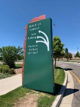 Airport wayfind sign on the side of the road