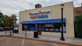 Precision printing custom signage on the building