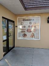 Roll and donuts custom graphics on the brown wall