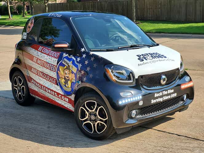 A Patrol Stories car covered in vehicle wrap