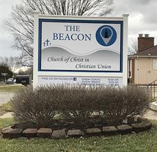 The Beacon Monument signage outside the house