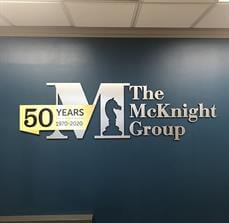 The McKnight Group interior signage on the wall of the office