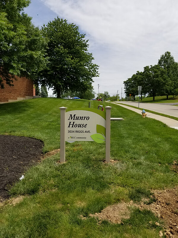 green and white Munro house signage