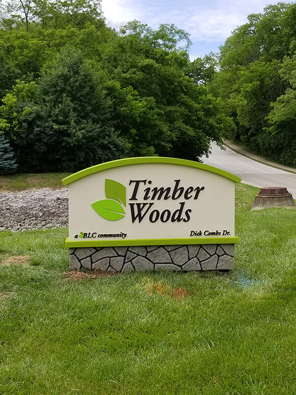 Green and white timber woods monument signage