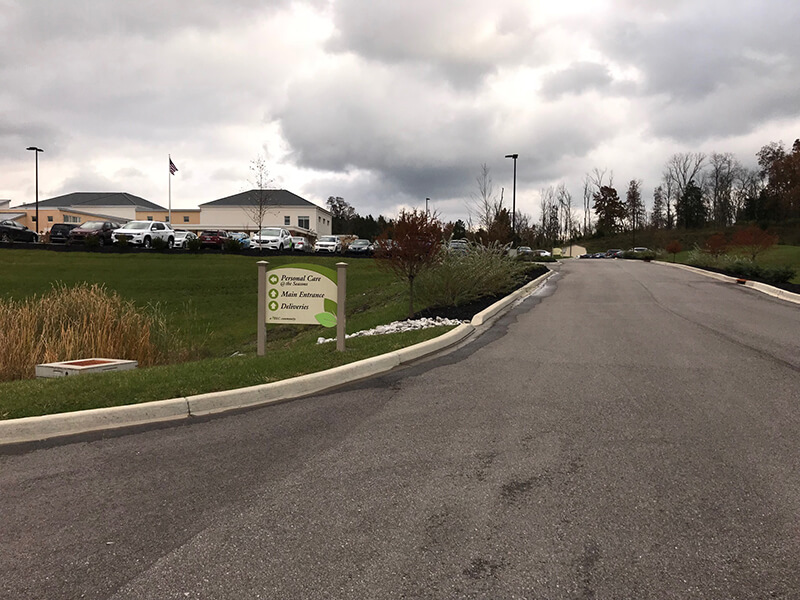Green and white signage on the side of the road