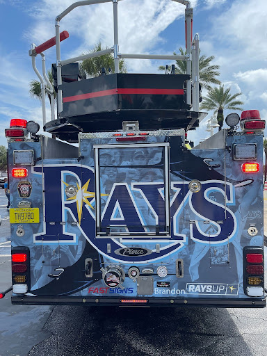 a fire truck is decorated in rays themed wrap