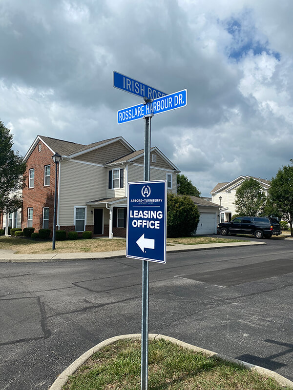 Leasing office sign on the side of the road