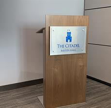The citadel sign on the table in the corner of the room