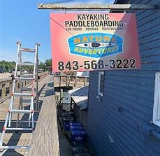 Custom hanging sign on the building