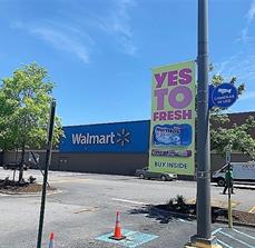 Hanging signage on the pole and Wallmart signage