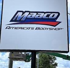 Maaco signage on the pole