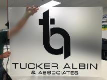 Tucker Albin custom decal holding by an employee
