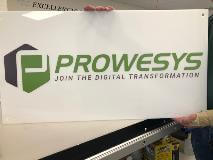 Prowesys custom sign holding by the employee