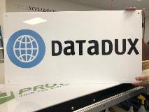 Datadux custom sign holding by an employee