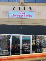 City Accessories Signage  on the store building with lights on top of the signage