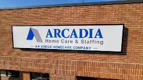 Arcadia Home Care & Staffing Signage on the brick wall 
