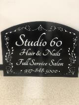 Studio 60 Custom signage with black and white design display on the wall