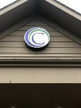 Letter C logo under the roof of the house 