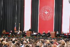 red and black back drop curtain in crowd and speakers