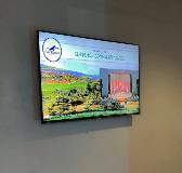 Advertisement in a television with white wall