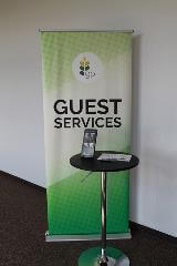 Guest Services banner with phone and table