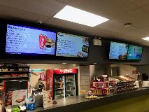 Menu for fast food with food on display and soft drinks