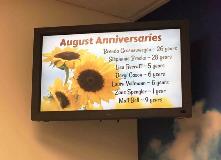 August anniversaries digital display with design on the corner