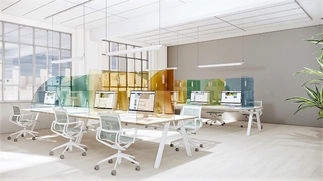 an office uses colored plexi glass between desks