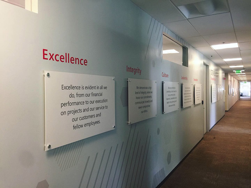 Company values are placed along an office wall