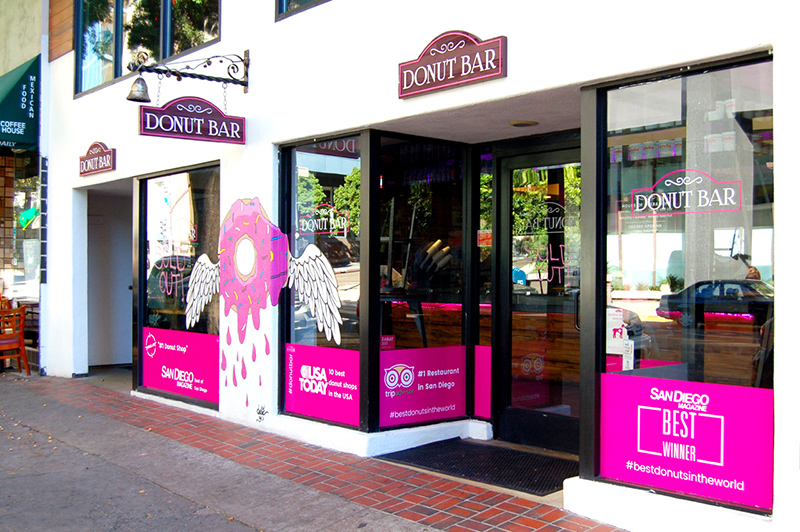 consistent branding is used on the exterior of a donut shop